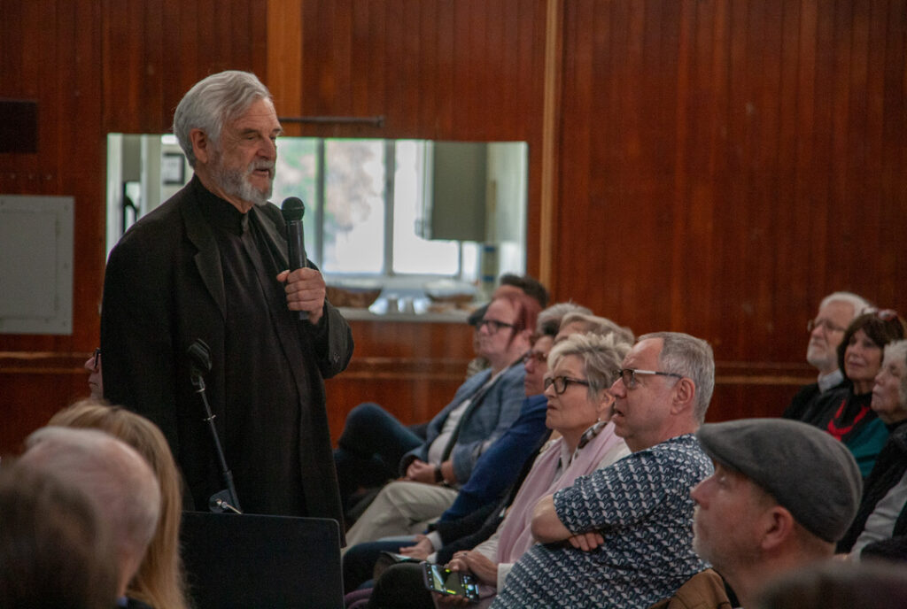 Dr. Raymond Neutra speaking to a group